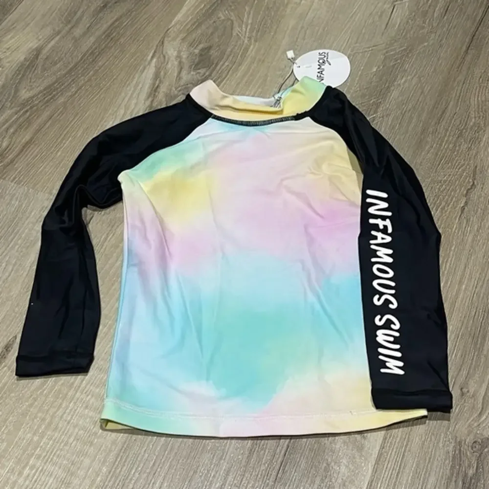 Infamous mini swim rash guard shirt size 0 Tie-dye design with black sleeves NWT